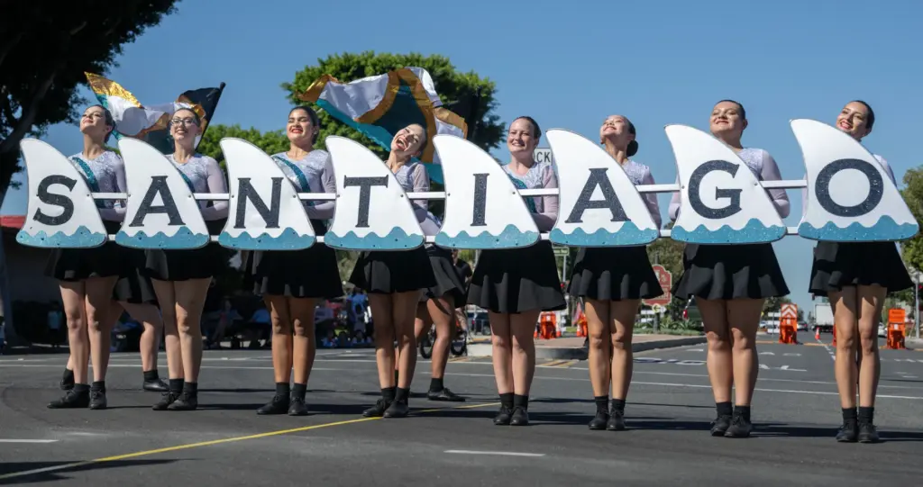The Santiago High School color guard performs in the Tustin...