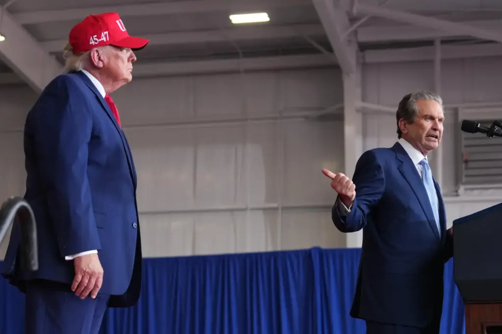 President Donald Trump listens as Georgia gubernatorial candidate Rick Jackson...