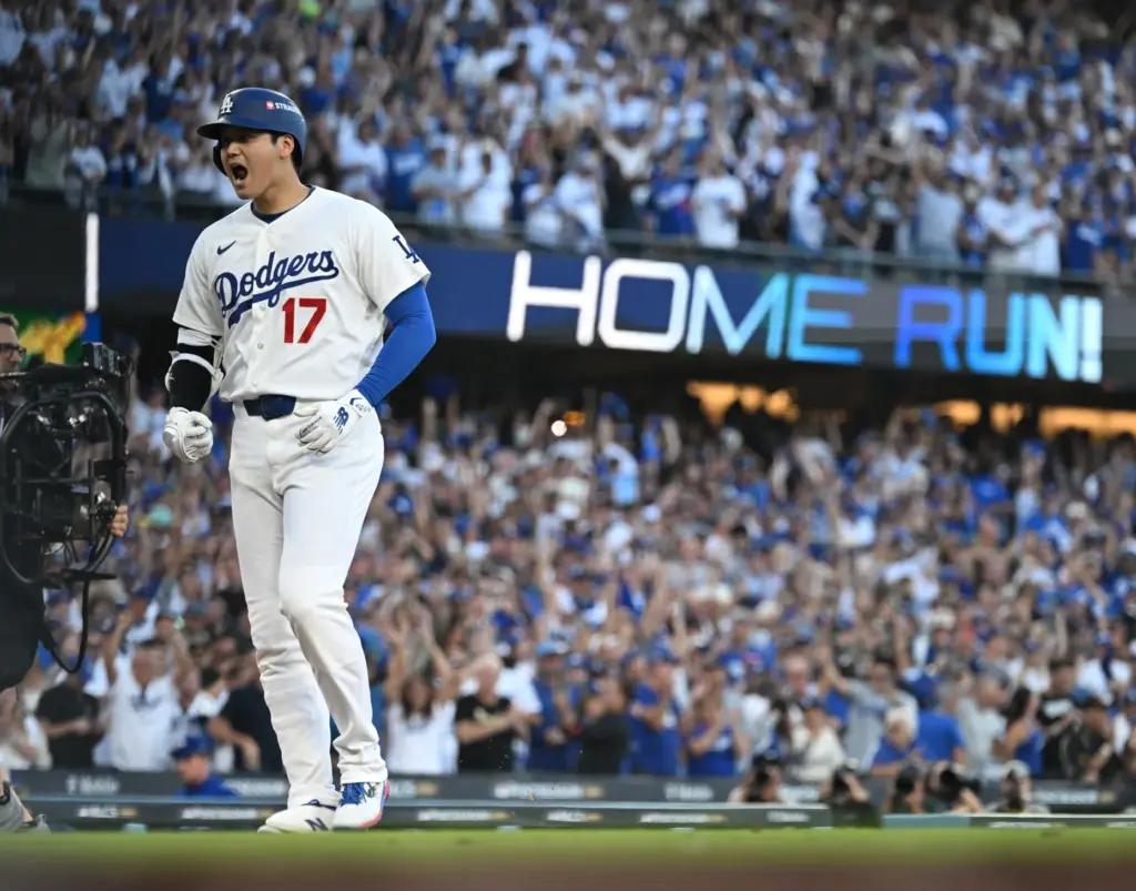 Dodgers star Shohei Ohtani celebrates after hitting a three-run home...
