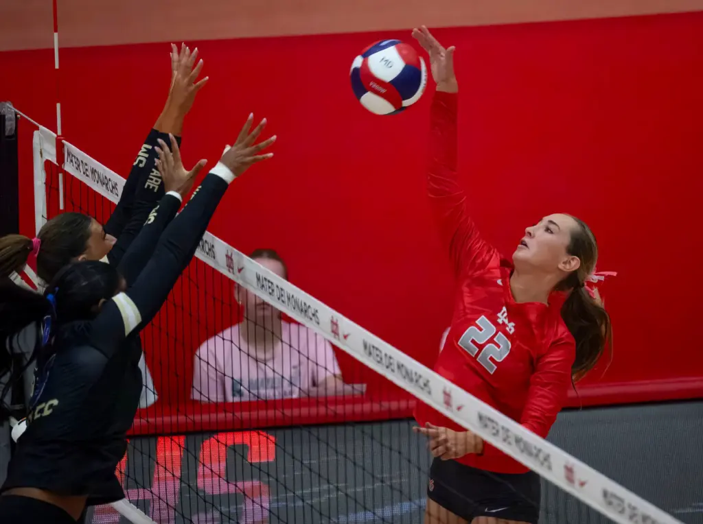 Mater Dei’s Katherine Nowak, right, takes a shot against Santa...