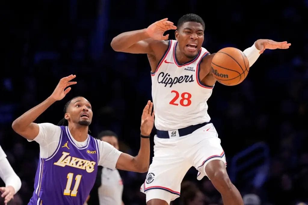 Clippers forward Rui Hachimura, right, goes after a loose ball...