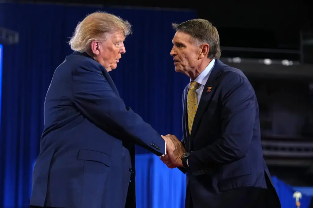 Kentucky Republican congressional candidate Ed Gallrein, right, shakes the hand...