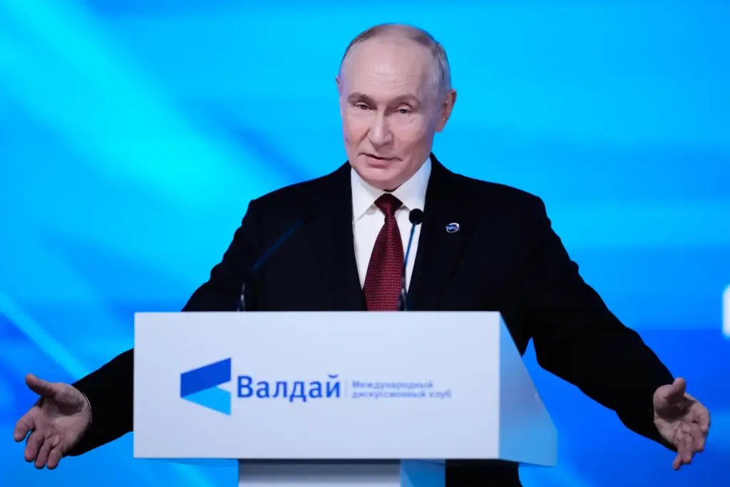 Russian President Vladimir Putin gestures speaking at the session of...