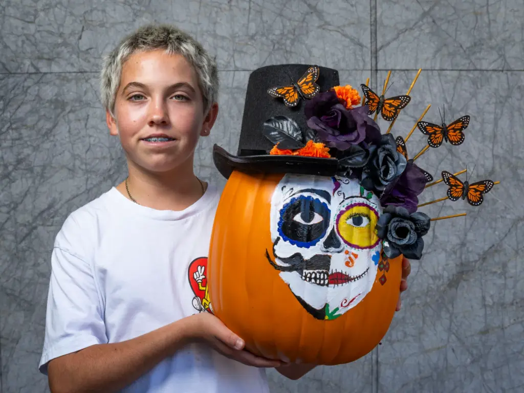 Dylan Lechler holds his pumpkin titled âDos Almas (Two Souls)â...