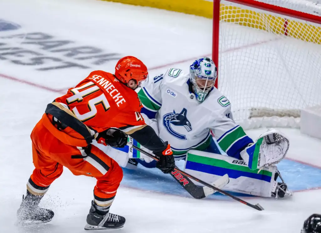 The Ducksâ Beckett Sennecke, left, takes a shot as Vancouver...