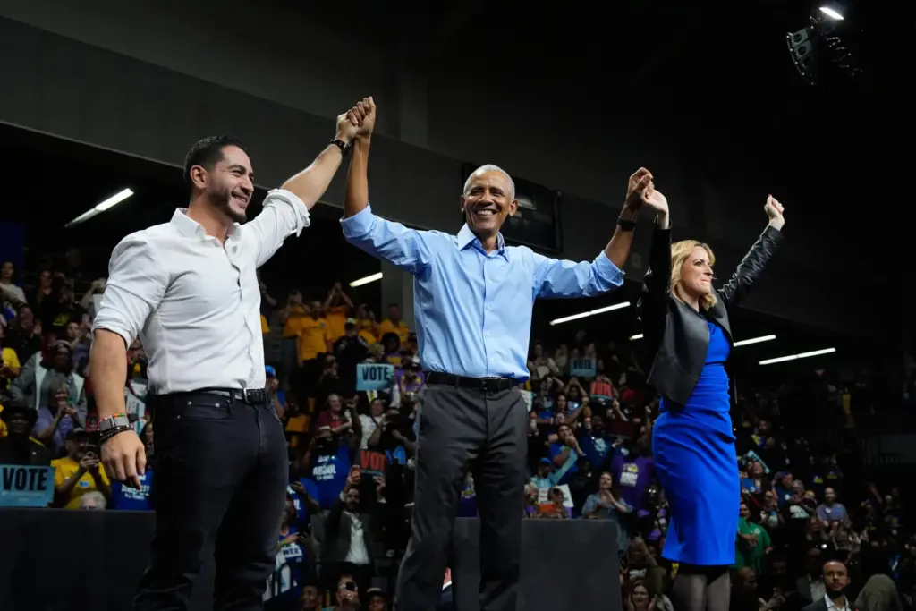 Former President Barack Obama, center, joined by Democratic nominee for...