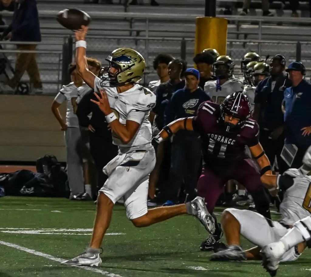 El Segundo quarterback Ryan Wiacek runs with the ball during...