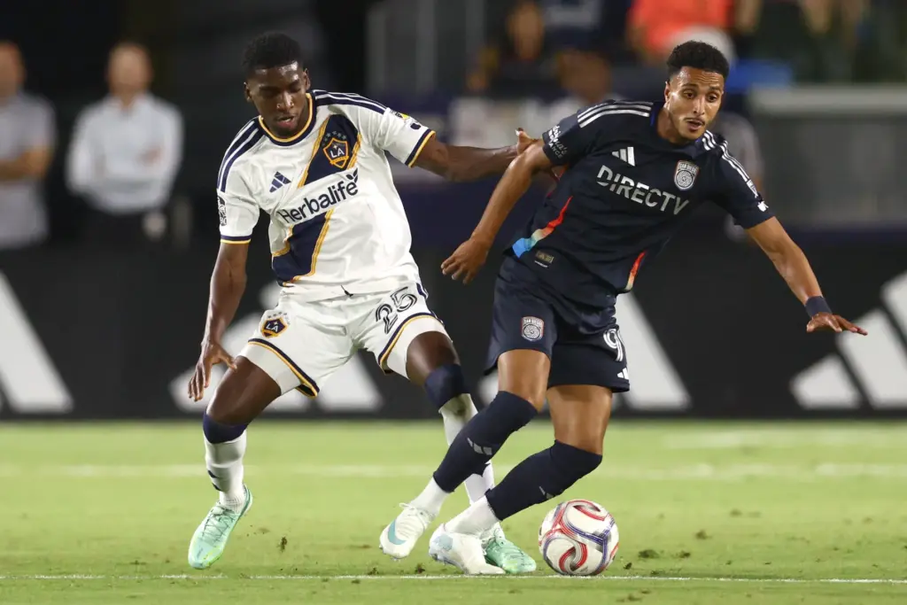 Los Angeles Galaxy defender Emiro GarcÃ©s, left, defends against San...