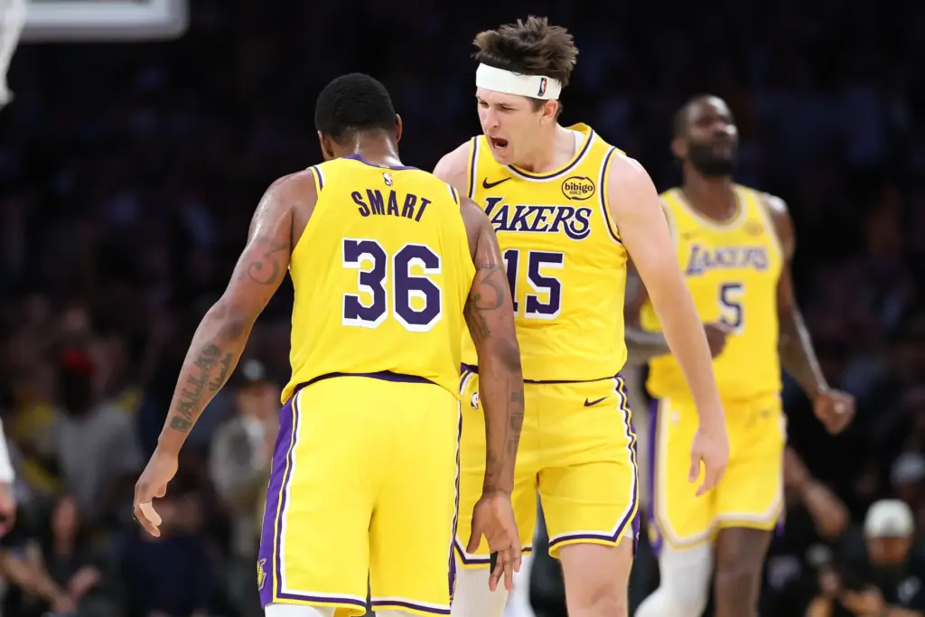 Lakers guard Austin Reaves, right, congratulates guard Marcus Smart after...