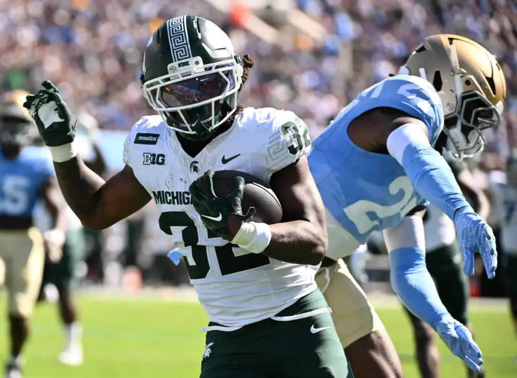 Michigan State running back Kenneth Williams (32) runs past UCLA...