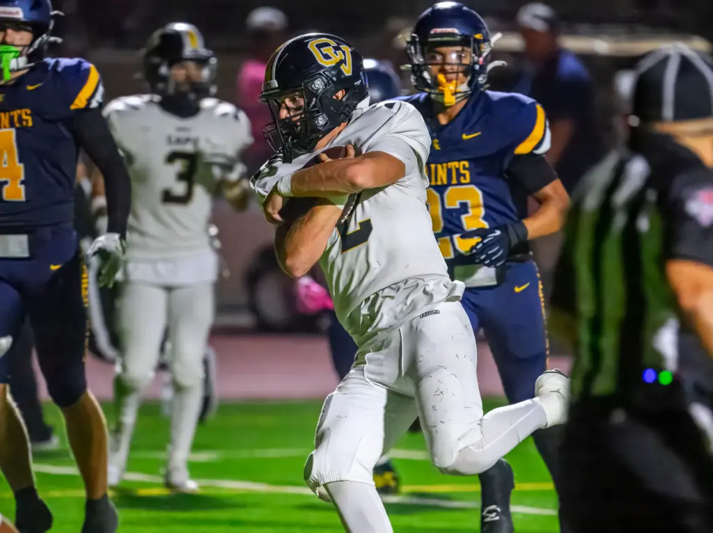 Capistrano Valley quarterback Talon Spencer scores a touchdown against Crean...