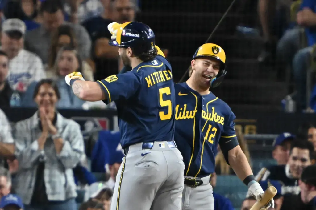 The Milwaukee Brewers’ Garrett Mitchell, left, and Cooper Pratt celebrate...