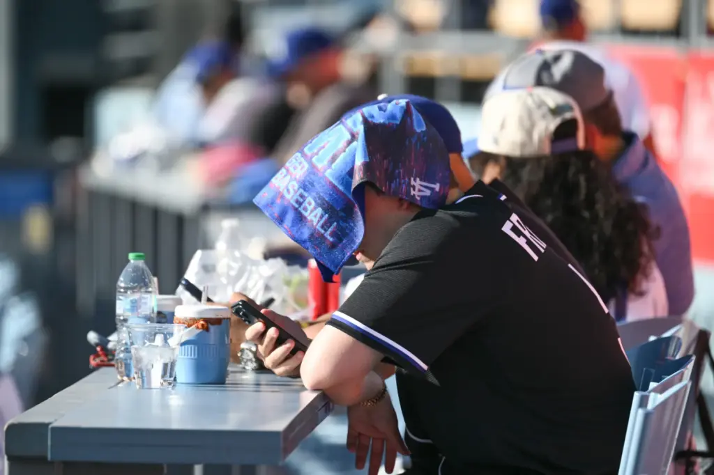 A Dodgers fan in the outfield stands keeps his cool...